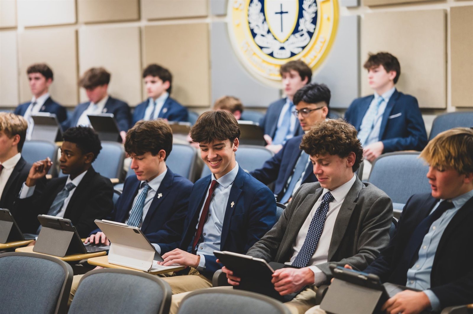 Salesianum students in blazers gathered close together at an assembly